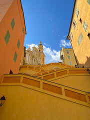 The Basilica of Saint-Michael the Archangel in Menton, France. The tall bell tower on the right...