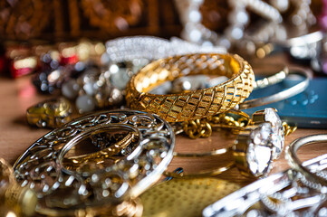 closeup of beautiful costume jewelry, earrings, beads, bracelets and rings