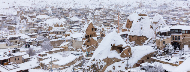 Nevsehir, Turkey, February, 01, 2022: Pigeon Valley and Cave town in Goreme during winter time. Cappadocia, Turkey. 