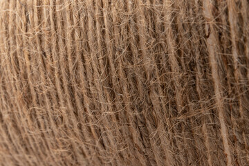 close-up of brown jute twine for DIY and gift wrapping, isolated on white background, concept of...