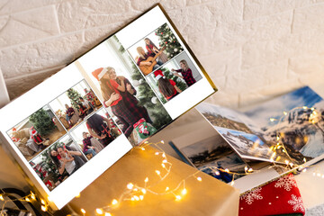 young family photo book. Christmas on the background. Christmas holiday