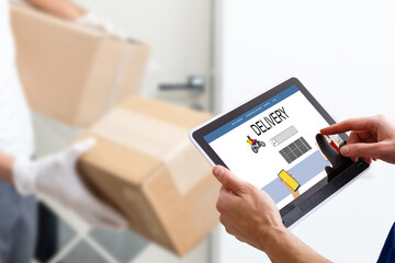 delivery, mail, people and shipping concept. Young woman sign in tablet after receiving parcel from courier at home.