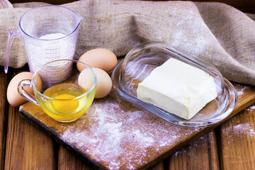 Cooking concept. Food ingredients for cooking on wooden background