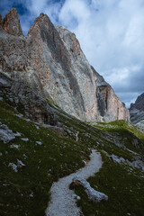 The landscape and the peaks of the Dolomites of the Val di Fassa, one of the most famous and touristic valleys of Trentino, near the town of Canazei, Italy - August 2022.
