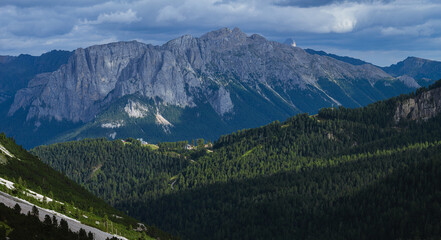 The landscape and the peaks of the Dolomites of the Val di Fassa, one of the most famous and touristic valleys of Trentino, near the town of Canazei, Italy - August 2022.