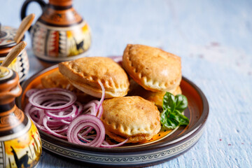 Homemade empanadas with sauces.