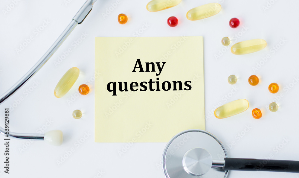 Poster a card with text any questions on a table with pills and a stethoscope