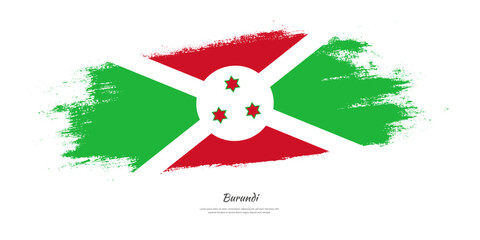 Happy Independence Day of Burundi. National flag on artistic stain brush stroke background.