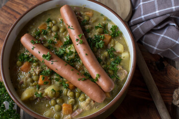 Pea soup with vienna sausage in a bowl