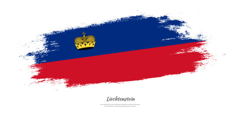 Happy National Day of Liechtenstein. National flag on artistic stain brush stroke background.