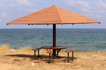 Umbrella in the city park near the sea.