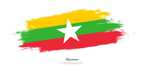 Happy Independence Day of Myanmar. National flag on artistic stain brush stroke background.