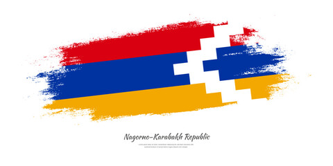 Happy National Day of Nagorno-Karabakh Republic. National flag on artistic stain brush stroke background.