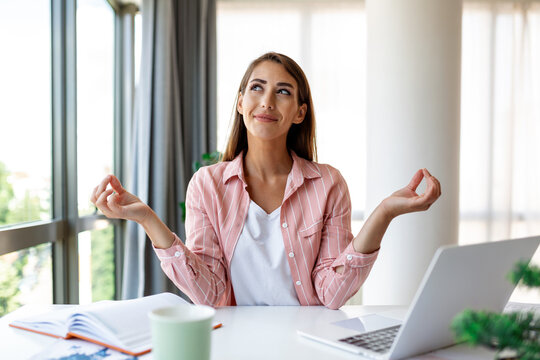 Calm Woman Relaxing Meditating With Laptop, No Stress Free Relief At Work Concept, Mindful Peaceful Young Businesswoman Or Student Practicing Breathing Yoga Exercises At Workplace, Office Meditation