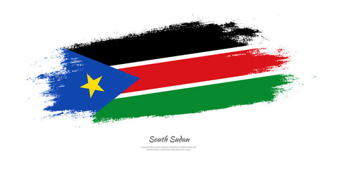 Happy Independence Day of South Sudan. National flag on artistic stain brush stroke background.