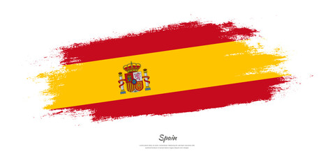 Happy Independence Day of Spain. National flag on artistic stain brush stroke background.