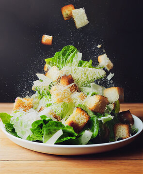 3D rendering realistic digital illustration. Delicious caesar salad is coming. A high-speed freeze-motion food image.