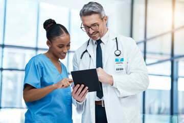 Teamwork, tablet and healthcare with a doctor and nurse working together as a team in the hospital....