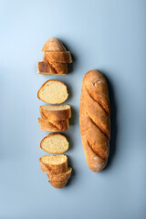 fresh wheat flour baguette on a blue background
