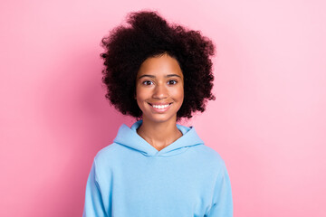 Photo of cute sweet optimistic girl dressed blue sportswear hood show toothy smile good mood isolated on pink color background