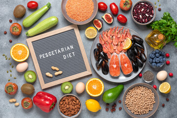 Pescetarian diet products. Healthy organic food. Top view, flat lay. Seafood, fruits, vegetables, berries, legumes, nuts and seeds.