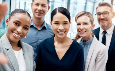 Fototapeta premium Selfie, office and diversity, business people or team standing in corporate workplace together. Portrait, trust and friends, colleagues or group take picture for happy memory after boardroom meeting.