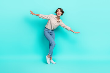 Fototapeta na wymiar Full length photo of pretty lady stylish outfit open arm look up empty space proposition weekend abroad isolated on cyan color background