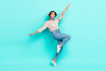 Fototapeta na wymiar Full length photo of astonished lovely lady dressed nice clothes open arm falling down chasm empty space isolated cyan color background