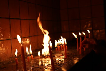 burning candles in a church
