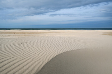 Landscape with sand structures, creating a new dune, at the beach between Łeba and the wandering dune Wydma Łącka in Poland  - obrazy, fototapety, plakaty
