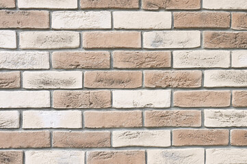 Texture of brick wall close up, beige bricks background. Bricklaying surface backdrop
