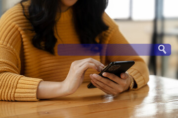 Female clicking internet search page smart phone touch screen in the office.
