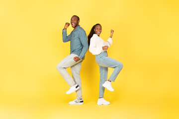Fototapeta na wymiar Joyful African American Couple Gesturing Yes Standing On Yellow Background