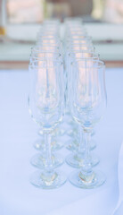 many wedding glasses with sparkling wine in restaurant