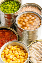 Processed canned food, long shelf life vegetables and fish. vertically.