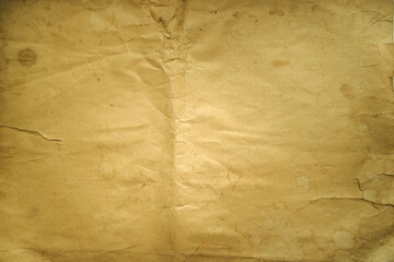 Photo of the texture of old yellowed paper. Paper background of an old manuscript for text. Vintage yellow paper for the background.