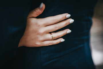 man and woman with wedding ring.Young married couple holding hands,