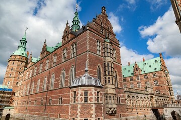 Historic Frederiksborg castle with its brick walls and copper roof in Hilerod, Denmark
