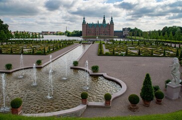 Historic Frederiksborg castle with the courtyard and lake in Hilerod, Denmark