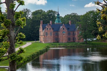 Historic Frederiksborg castle with the courtyard and lake in Hilerod, Denmark