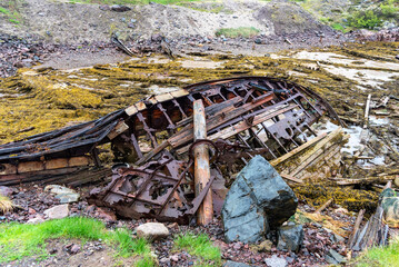 Ship cemetery on the coast of the Barents Sea in Teriberka. Old broken fishing boats in Kola Peninsula, Russia