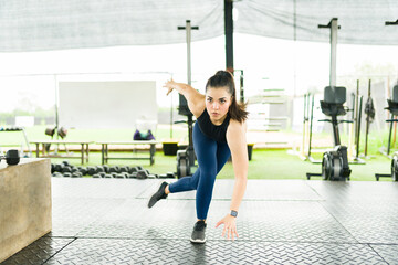 Fit sporty woman doing cardio exercises at the gym