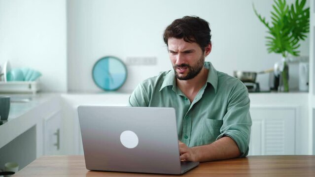 Charming man feels baffled having lack of understanding while working on laptop, learn new software, feeling physical or mental exhaustion caused by overwork or stress. Information overload concept