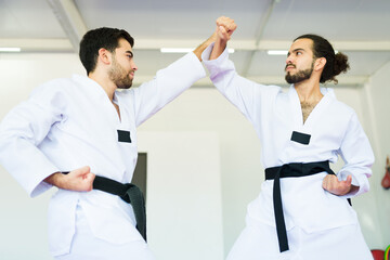 Fototapeta premium Male fighters training taekwondo or karate