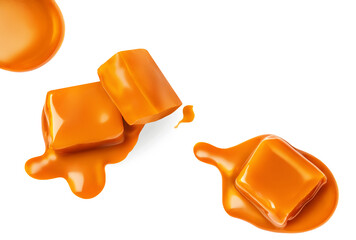 Caramel candies and flowing  caramel sauce isolated on a white background. Pieces of toffee candies...