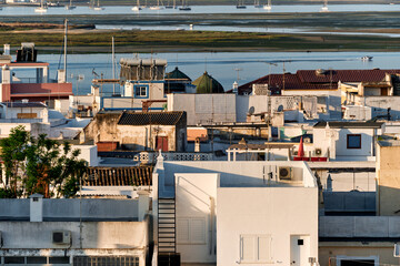 view of cubic houses and sandbank in Olhao, Algarve, Portugal