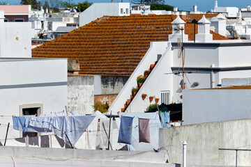 The terraces lined with balustrades are linked together by small stairs in the Cubist architecture in Olhao, Algarve, Portugal