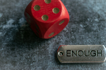 Gambling die with an 'enough' affirmation