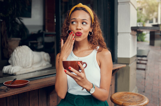 Coffee, Cafe And Hand Of A Black Woman With Funny Face While Sitting By A Counter At An Outdoor Restaurant. Coffee Shop, Quirky And Makeup With A Playful Young Female Enjoying A Drink From A Mug