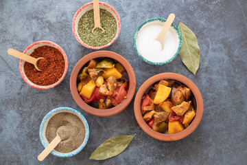 Top view of Turkish dish Guvech - baked meat with eggplant and traditionally served in earthenware pot (Turkish name; etli patlican guvec)